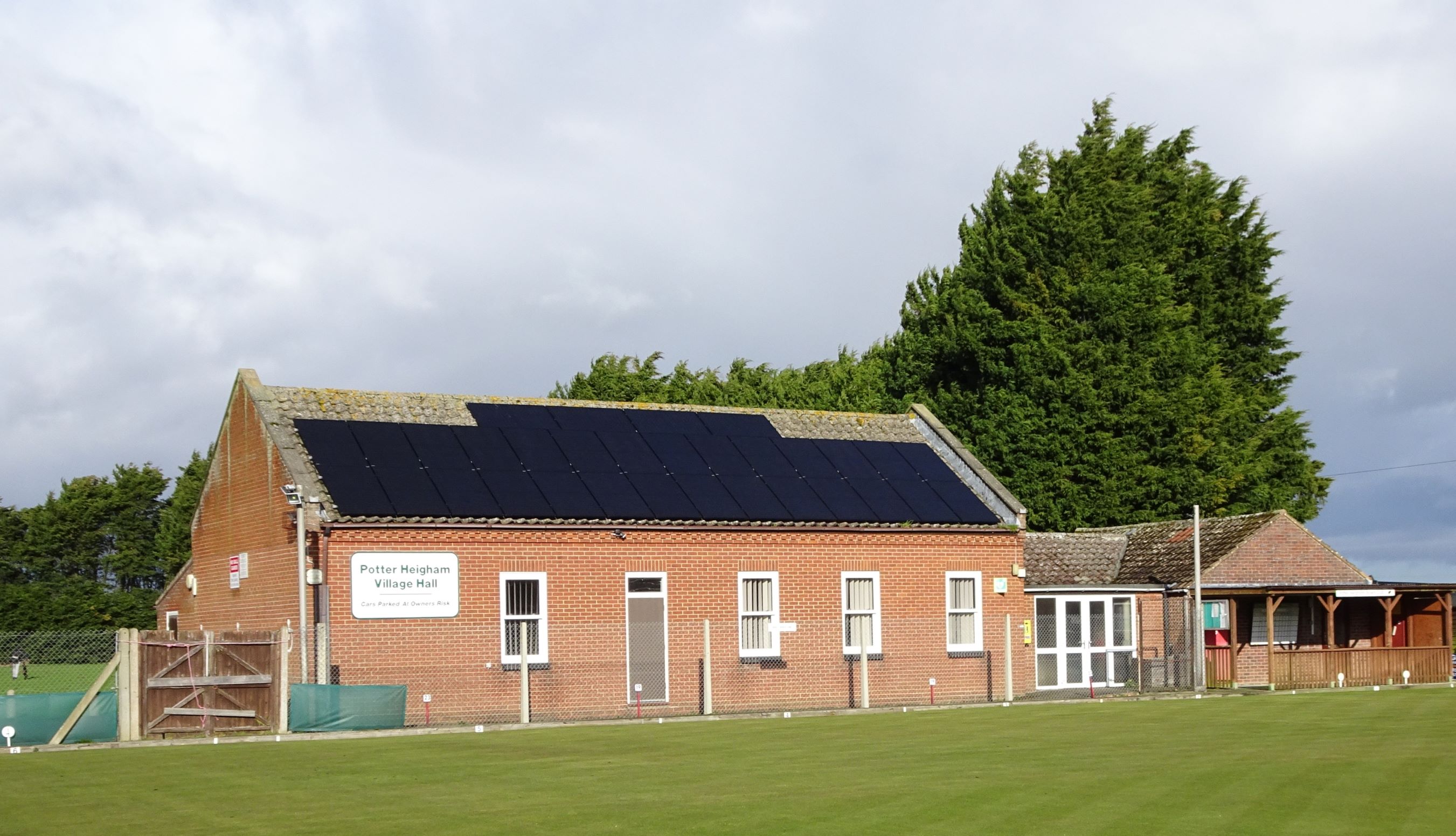 Potter Heigham Village Hall, with the bowls green in the foreround